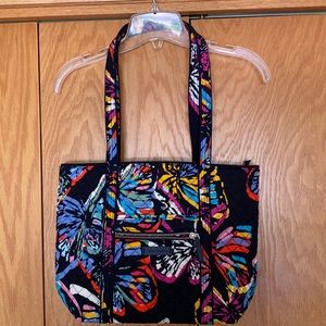 Brand new/no tags. 4 interior pockets and outside zipper pocket.